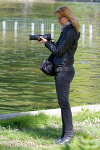 Woman preparing to take photos with a digital camera